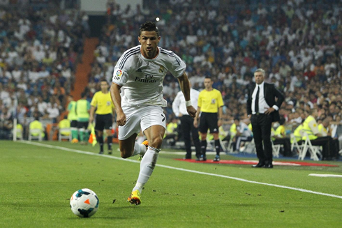 Cristiano Ronaldo sprinting with Carlo Ancelotti behind