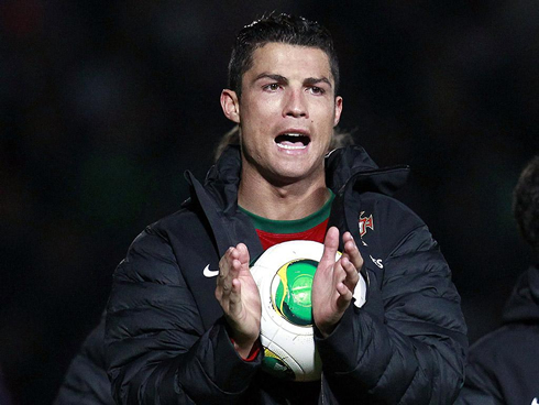 Cristiano Ronaldo grabbing the ball and taking it home, after scoring his first hat-trick for Portugal