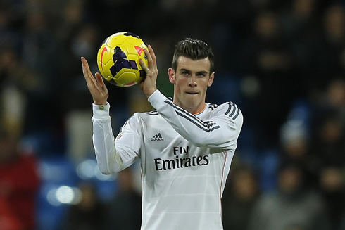 Gareth Bale taking the hat-trick game ball home