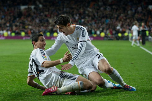 Di María sliding on the turf with Alvaro Morata