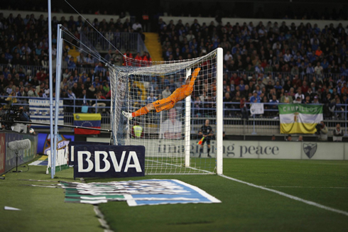 Cristiano Ronaldo balancing on the goal crossbar