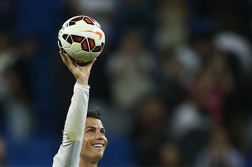 Cristiano Ronaldo holding a football