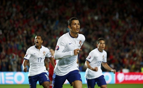 Cristiano Ronaldo wearing Portugal's white jersey and blue shorts