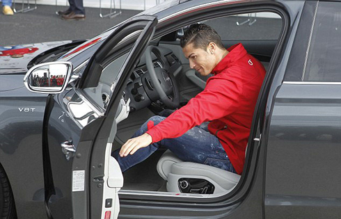 Cristiano Ronaldo entering his new car, the Audi S8