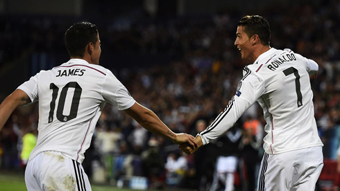 James Rodríguez holding Cristiano Ronaldo's hand