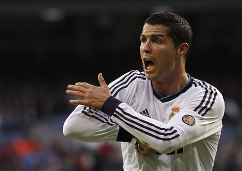 Cristiano Ronaldo disturbed and complaining about a shoulder charge during a game for Real Madrid