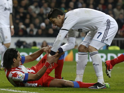 Cristiano Ronaldo helping Radamel Falcao to stand up, in Real Madrid vs Atletico Madrid, for the Spanish League La Liga, in 2012-2013