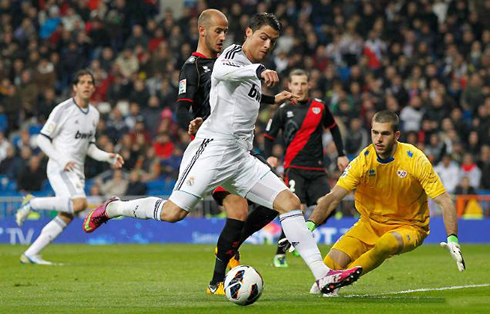 Cristiano Ronaldo dribbling the goalkeeper and trying to finish it for Real Madrid