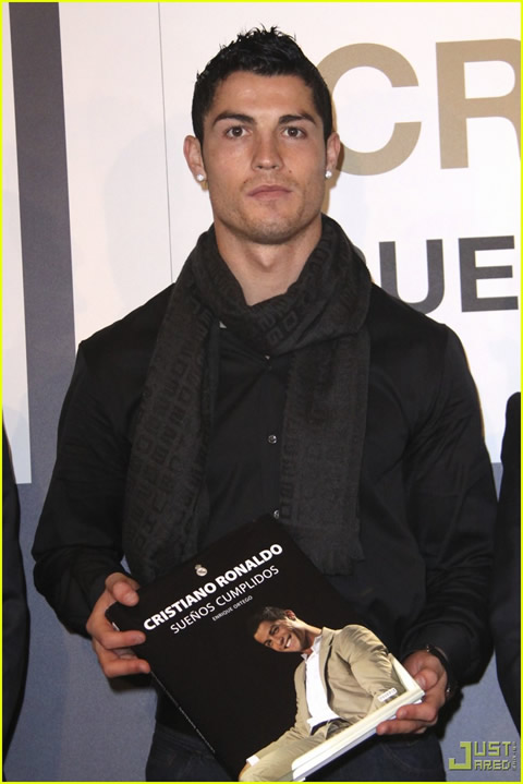 Cristiano Ronaldo fashion all dressed in black, wearing a scarf